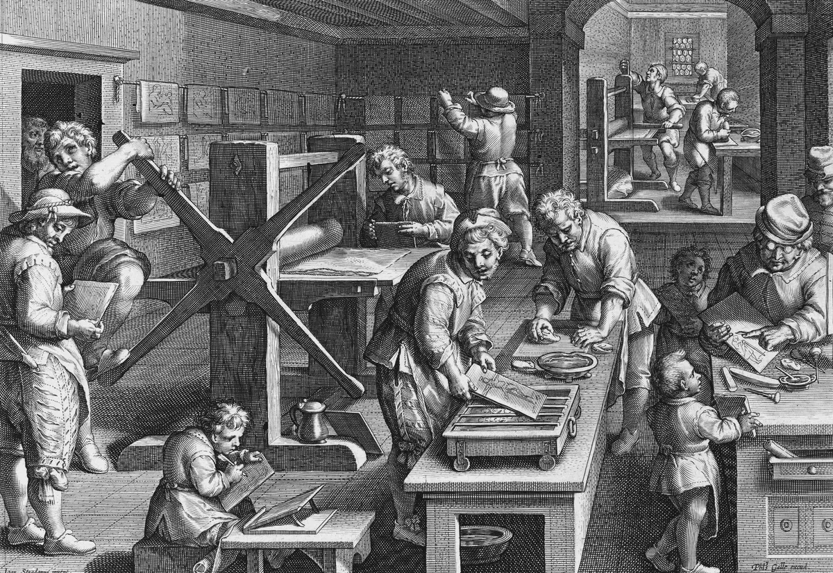 An engraved print workshop: one man turns the great star-wheel of a rolling press, others ink and wipe copper plates at a long table, a boy engraves a plate on his knee, and printed sheets hang drying along the wall.